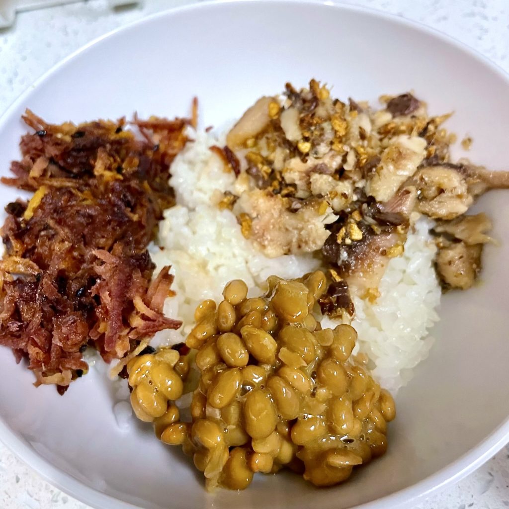 rice bowl with natto, carrots, and sardines